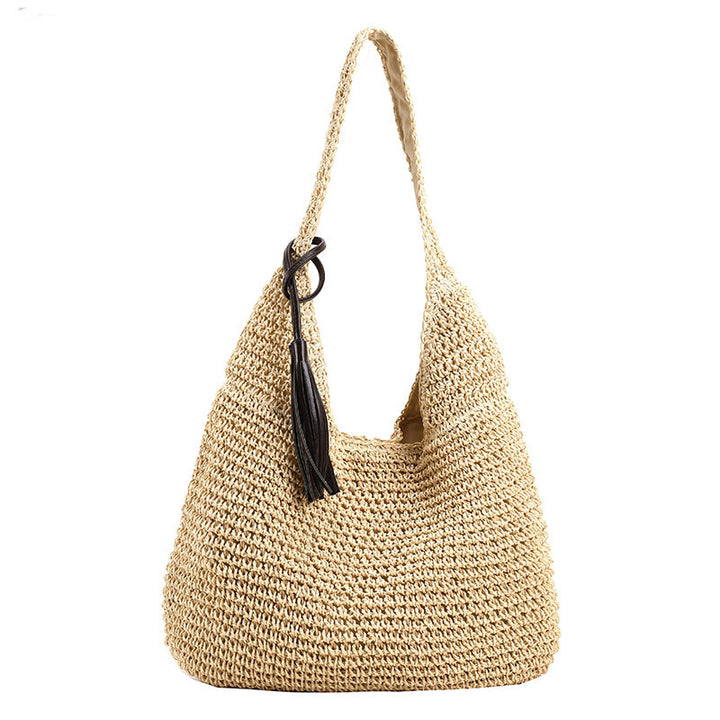 Bolso de playa tejido con correa.